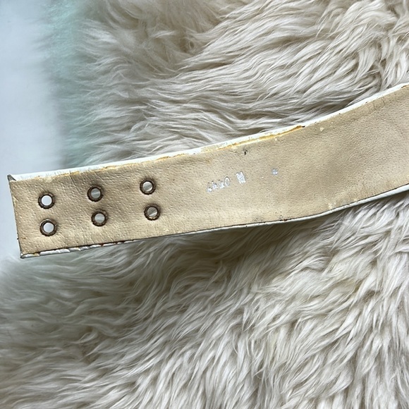 Vintage 80s Nina Arjani white leather medium waist belt heavy brass metal